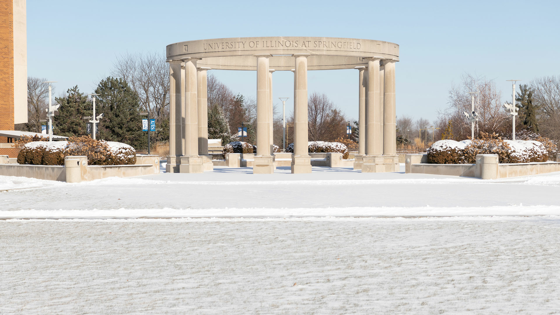 the colonnade in the background with a light snowfall in the foreground