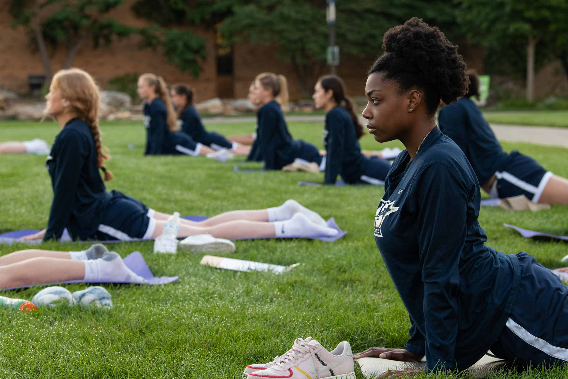 UIS Athletics team participating in yoga on the Quad