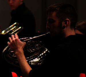 Musician playing french horn