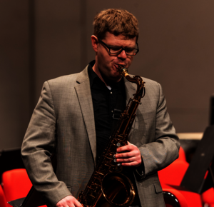 Person playing saxophone